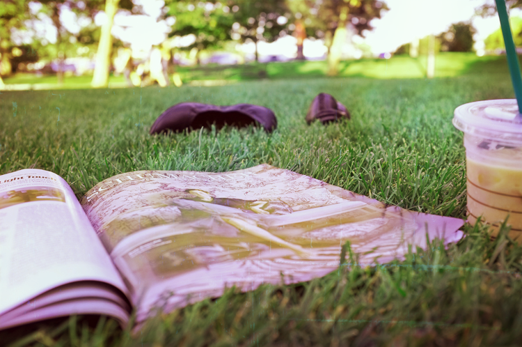Magazineandcoffeeinthegrass.png